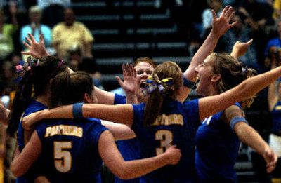 
The Mead volleyball team celebrates after sweeping University to go to 4-0 in the GSL.
 (Jed Conklin / The Spokesman-Review)