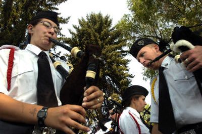 
The St. Joseph's Pipe and Drum Corps performs at the welcoming ceremony of the 48th annual Highland Games on Saturday at the Spokane County Fair and Expo Center. (Editor's note: An earlier version of this story incorrectly identified the group as the Angus Scott Pipe Band.)
 (P hotos by Jed Conklin / The Spokesman-Review)