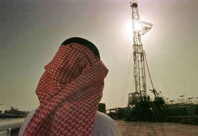 
An official of the Saudi oil company Aramco watches progress at a rig at the al-Howta oil field near Howta, Saudi Arabia. Oil prices surged close to $42 a barrel Monday .
 (File/Associated Press / The Spokesman-Review)