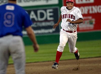 
Spokane's Lizahio Baez legs out a triple in the fourth inning of Monday night's loss to Vancouver at Avista Stadium.
 (Holly Pickett / The Spokesman-Review)