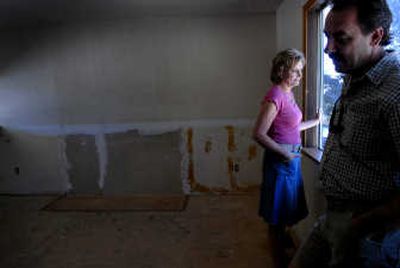 
Julie and Joe Mazzuca, founder and president of Meth Lab Cleanup LLC, at a former meth house in North Idaho. Their nationwide company works with contractors to clean up meth labs and trains other crews on how to do it. 
 (Kathy Plonka / The Spokesman-Review)