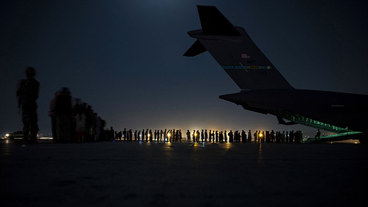 In this Aug. 21, 2021 image provided by the U.S. Air Force, U.S. Air Force aircrew, assigned to the 816th Expeditionary Airlift Squadron, prepare to load qualified evacuees aboard a U.S. Air Force C-17 Globemaster III aircraft in support of the Afghanistan evacuation at Hamid Karzai International Airport, Kabul, Afghanistan. An Afghan man who worked for the U.S. government in Afghanistan says the Biden administration has ignored his pleas for help to evacuate his two young sons from Afghanistan after their mother died of a heart attack while being threatened by the Taliban. The International Refugee Assistance Project on Thursday, Oct. 7, 2021 filed a lawsuit against Secretary of State Antony Bilken on the man