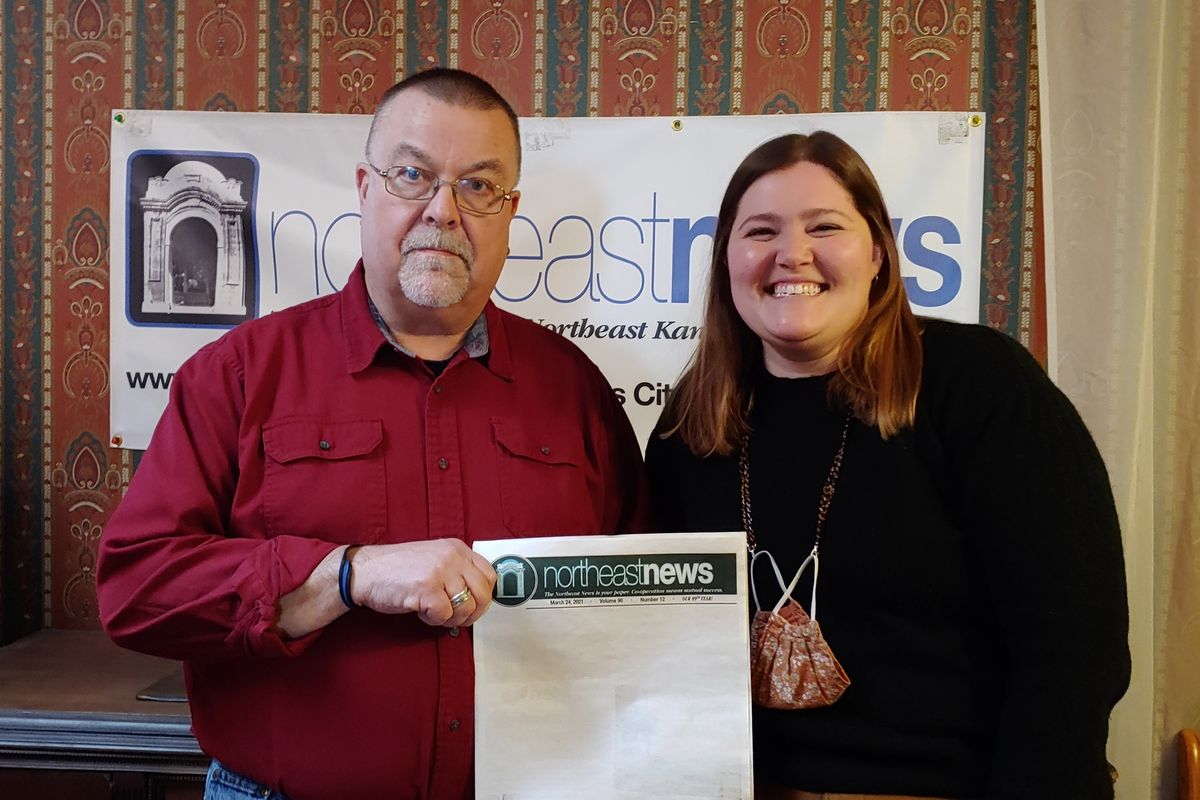 Publisher Michael Bushnell, left, and Managing Editor Abby Hoover pose in the offices of The Northeast News, a community paper in Kansas City, Mo., on March 31, 2021. The paper chose to leave the front page of their March 24 issue blank to show community members what they'd miss if the newspaper folded.  (HONS)