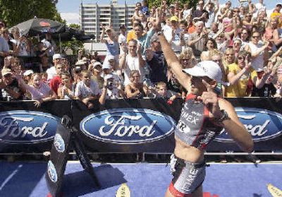 
Coeur d'Alene Ironman 2005 winner Viktor Zyemtsev crosses the finish line.
 (Tom Davenport/ / The Spokesman-Review)