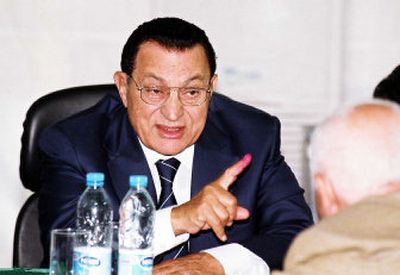 
Hosni Mubarak, leader of the ruling National Democratic party, talks to his party officials at the operation room of his party campaign in Cairo Wednesday. 
 (Associated Press / The Spokesman-Review)