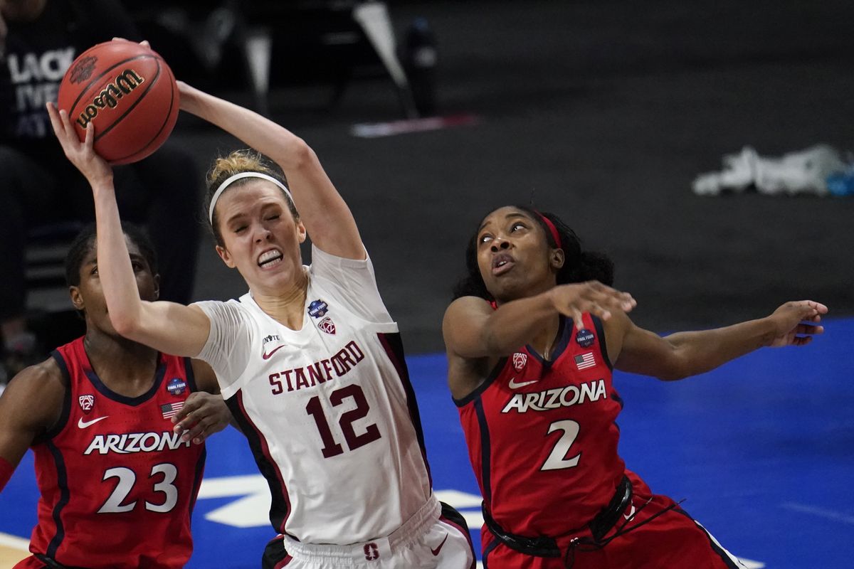 Stanford guard Lexie Hull (12) grabs a rebound over Arizona guard Aari McDonald (2) during the second half of the championship game in the women