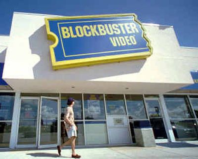 A man walks past a Blockbuster Video Store in Miamai in this file photo. Blockbuster announced Tuesday it will seek a hostile takeover of Hollywood Video. A man walks past a Blockbuster Video Store in Miamai in this file photo. Blockbuster announced Tuesday it will seek a hostile takeover of Hollywood Video. 
 (File/Associated PressFile/Associated Press / The Spokesman-Review)