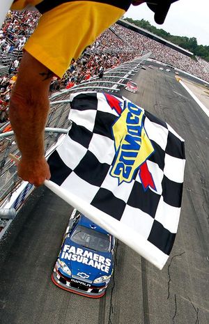 Kasey Kahne crosses the finish line to win the LENOX Industrial Tools 301 at New Hampshire Motor Speedway. (Photo Credit: Jeff Zelevansky/Getty Images) (Jeff Zelevansky / Getty Images North America)