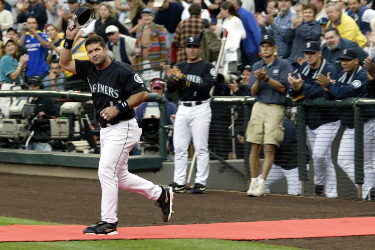 Seattle Mariners' Edgar Martinez watches his sacrifice fly to right field  in the seventh inning against the Oakland Athletics, Friday, Sept. 17,  2004, at Safeco Field in Seattle. The RBI, which scored