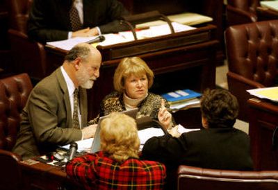 
 Sen. Lisa Brown, top right, confers with Sens. Adam Kline, Tracey Eide and Karen Keiser, bottom left, on the floor of the Senate.
 (PHOTO COURTESY OF ROBERT SUMNER / The Spokesman-Review)