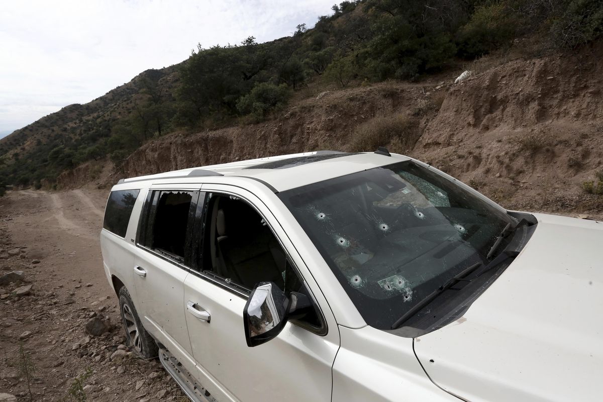 A bullet-riddled vehicle that members of LeBaron family were traveling in sits parked on a dirt road near Bavispe, at the Sonora-Chihuahua border, Mexico, Wednesday, Nov 6, 2019. Three women and six of their children, related to the extended LeBaron family, were gunned down in an attack while traveling along Mexico