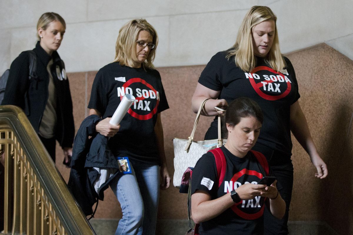 Opponents of a tax on sugary and diet beverages depart City Hall after City Council passed the tax, in Philadelphia, Thursday, June 16, 2016. Philadelphia has become the first major American city with a soda tax. (Matt Rourke / Associated Press)