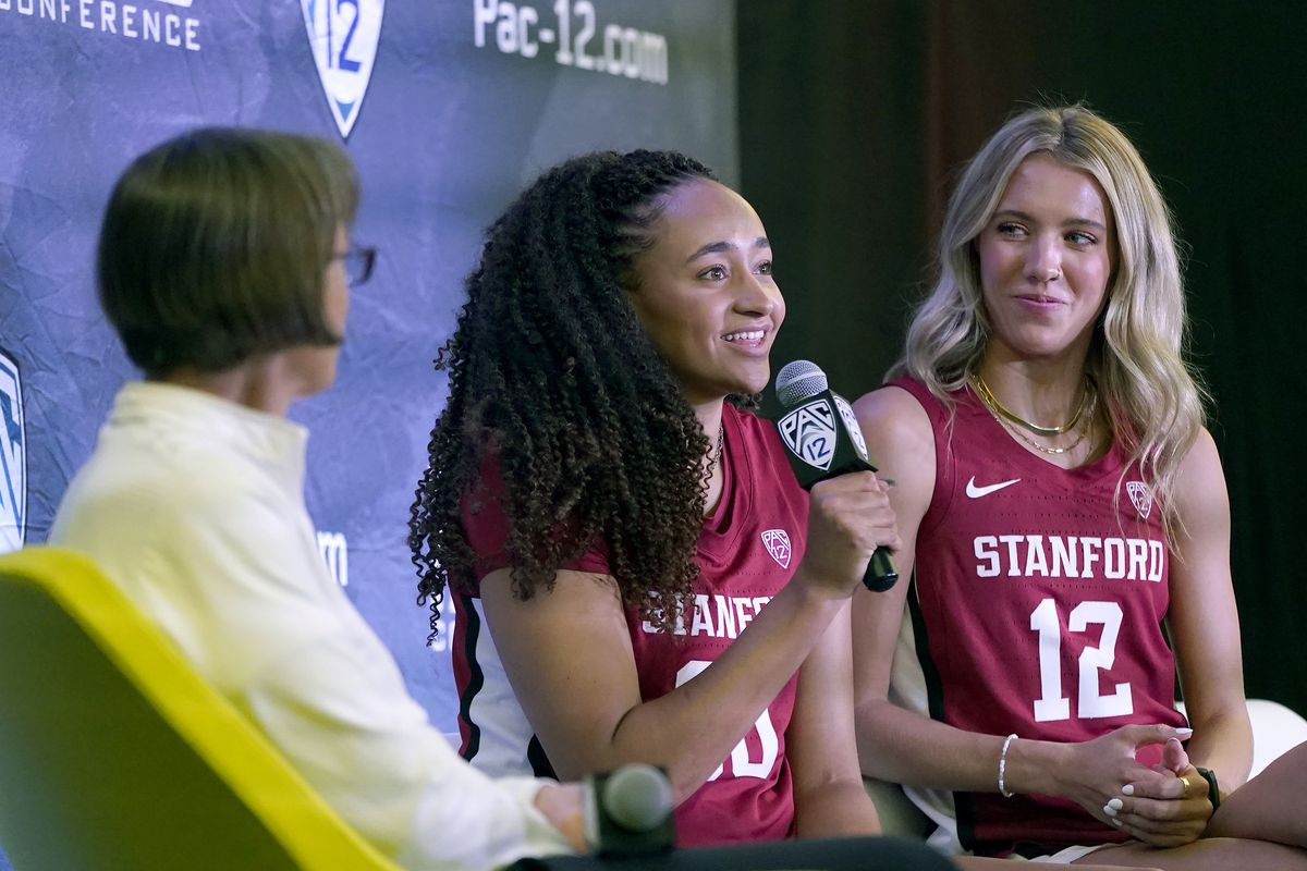 Stanford head coach Tara VanDerveer, left, listens as Haley Jones, center, speaks next to Lexie Hull during an NCAA college basketball news conference at the Pac-12 Conference media day Tuesday, Oct. 12, 2021, in San Francisco.  (Jeff Chiu)