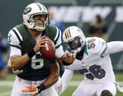 Jets quarterback Mark Sanchez, left, has become a mere caretaker, not a playmaker. (Associated Press)