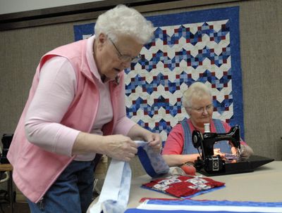 Gae Stroud, left, and Delma Wagstaff assemble quilts at the LDS Church on Boone and Molter in Liberty Lake Thursday.  (J. BART RAYNIAK / The Spokesman-Review)