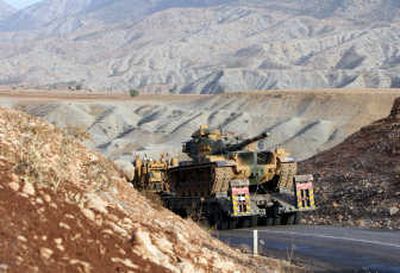 
A Turkish military truck carries a tank toward Sirnak near the Iraq border last week, two days after Kurdish rebels killed 13 Turkish soldier. Associated Press
 (Associated Press / The Spokesman-Review)