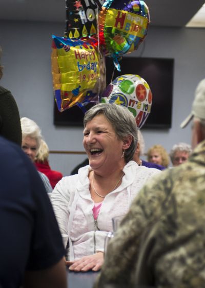 Kim Varner celebrates her 50th birthday at a surprise party with friends and family at Five Mile Heights Pizza on Jan. 29. Varner wasn’t sure she would live to see 50 because of breast cancer. (Colin Mulvany)