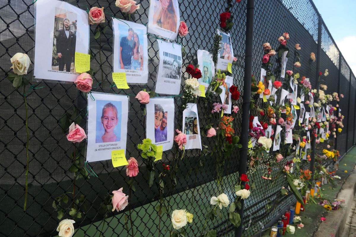 A makeshift memorial shows some of the people missing on June 26, 2021, from the 12-story oceanfront Champlain Towers South Condo, at 8777 Collins Ave., that partially collapsed on June 24, 2021, in Surfside, Florida. (Mike Stocker/South Florida Sun Sentinel/TNS)