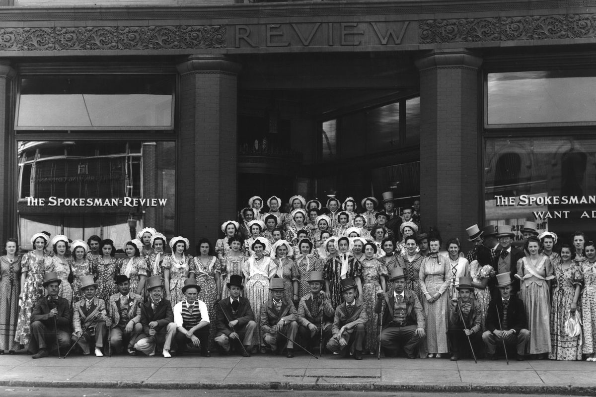 1939: Spokesman-Review employees, some of whom are in the cast of the Columbia Cavalcade historical presentation to mark the state’s Golden Jubilee, stand in front of the newspaper’s Review Tower, 999 W. Riverside Ave., in downtown Spokane. The play was scheduled to be performed Aug. 1-4 at the Spokane fairgrounds. The flowing dresses and bonnets were part of the official Cavalcade costumes that were becoming increasingly popular around Spokane as most of the city’s stores and business houses were encouraging the old-time garb. Spokane stores had been selling many billowy skirts, bonnets, colorful socks, gray top hats, fancy vests, canes and derbies to celebrate the state’s Golden Jubilee celebration. (Spokesman-Review Photo Archives)