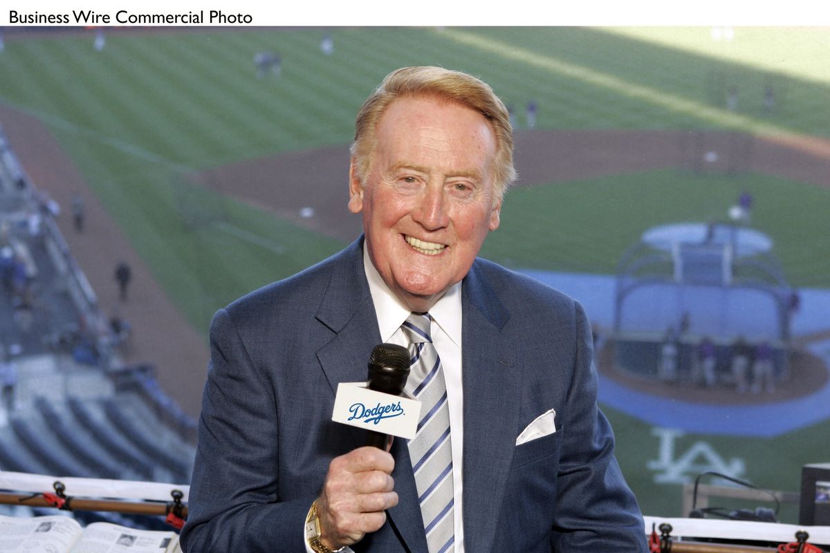 Vin Scully, who started broadcasting Dodgers games in 1950 in Brooklyn, will begin his 66th year with the team in L.A. in 2015. (Associated Press)