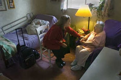 
Ruth Palnick, left, visits the home of Hospice patient Vivien Attrill. During the visits, they sing together, and Attrill shares the poetry she writes with Palnick.  
 (Photos by Christopher Anderson / The Spokesman-Review)