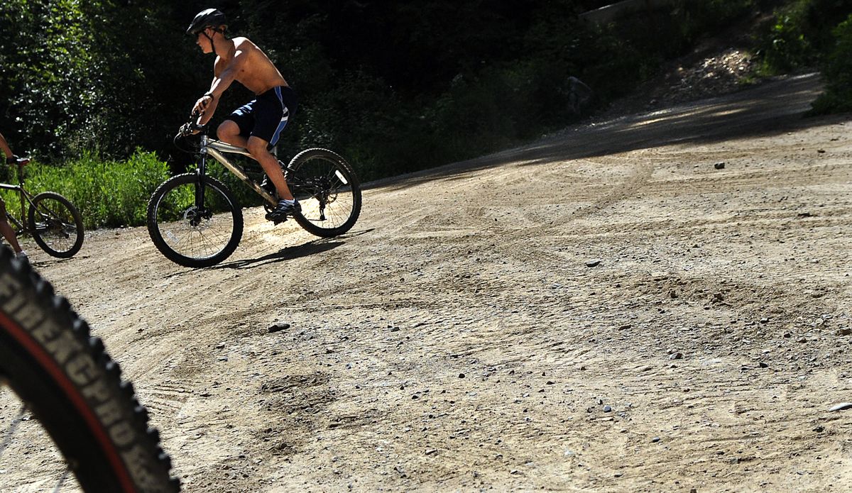 Cody Hammond of Coeur d’Alene completes a ride on Canfield Mountain on Tuesday. (The Spokesman-Review)
