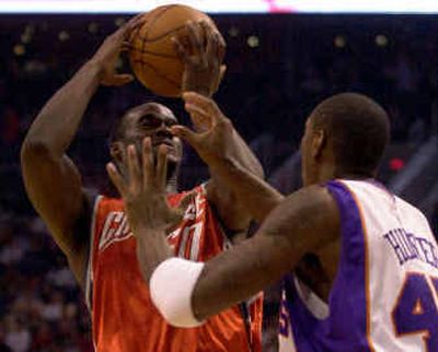 
 Emeka Okafor, left, broke Shaquille O'Neal's rookie record for consecutive double-doubles. 
 (Associated Press / The Spokesman-Review)