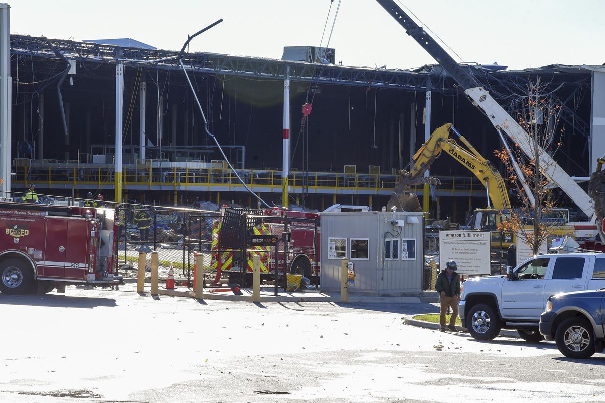 Emergency personnel look over damage, Saturday, Nov. 3, 2018, after a weather-related building collapse at an Amazon distribution warehouse on Baltimore's southeast side Friday night. Chief Roman Clark tells the Sun that a 50-foot wall collapsed late Friday at the Amazon Fulfillment Center as a storm hit the area. (Ulysses Munoz / Baltimore Sun)