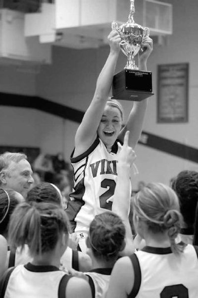 
Ali Johnson hoists trophy and gets a lift from her CdA teammates.
 (Bruce Twitchell Special to / The Spokesman-Review)