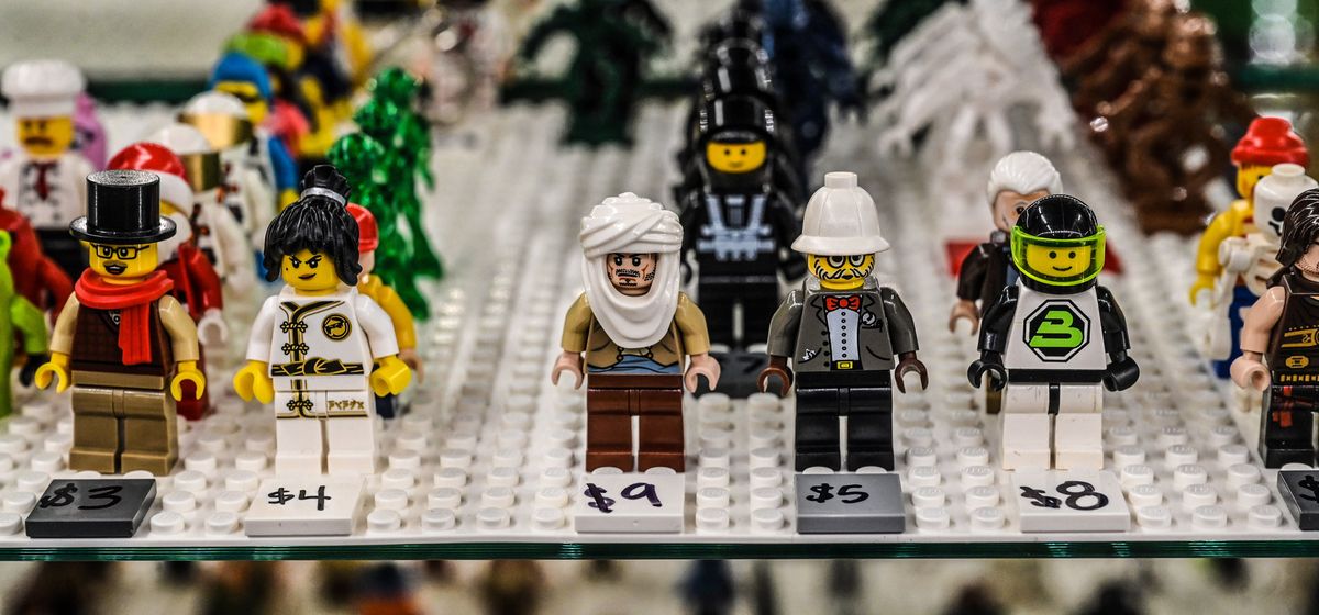 Lego people figures are for sale inside the counter at the Lego resale hobby store in Spokane’s Garland District.  (DAN PELLE/THE SPOKESMAN-REVIEW)