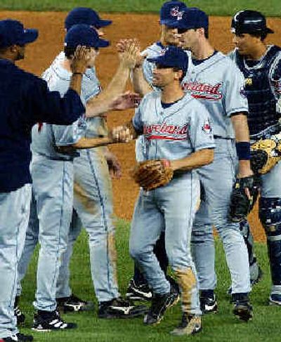 
Cleveland shortstop Omar Vizquel, center, is congratulated after collecting six hits in a 22-0 win over the Yankees.
 (Associated Press / The Spokesman-Review)