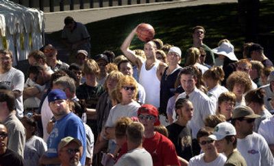 
Some of the 6,000 teams for Hoopfest '05 wait to pick up team packets near center court on Thursday at Riverfront Park. 
 (Brian Plonka / The Spokesman-Review)