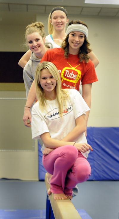 The University High School Titans senior gymnasts are, front to back, Taylor Rydeen, Jessica Vent-Gmeiner, Moriah Knowles and Katelyn Nemitz. They are trying to get their team back to the state 3A gymnastics meet. (Jesse Tinsley)