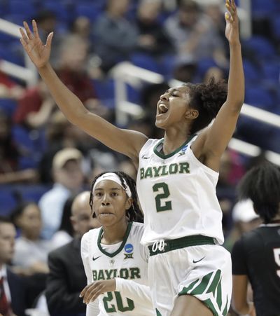 Baylor’s DiDi Richards  reacts after a basket against South Carolina during Saturday’s  NCAA Tournament game in Greensboro, N.C. (Chuck Burton / AP)