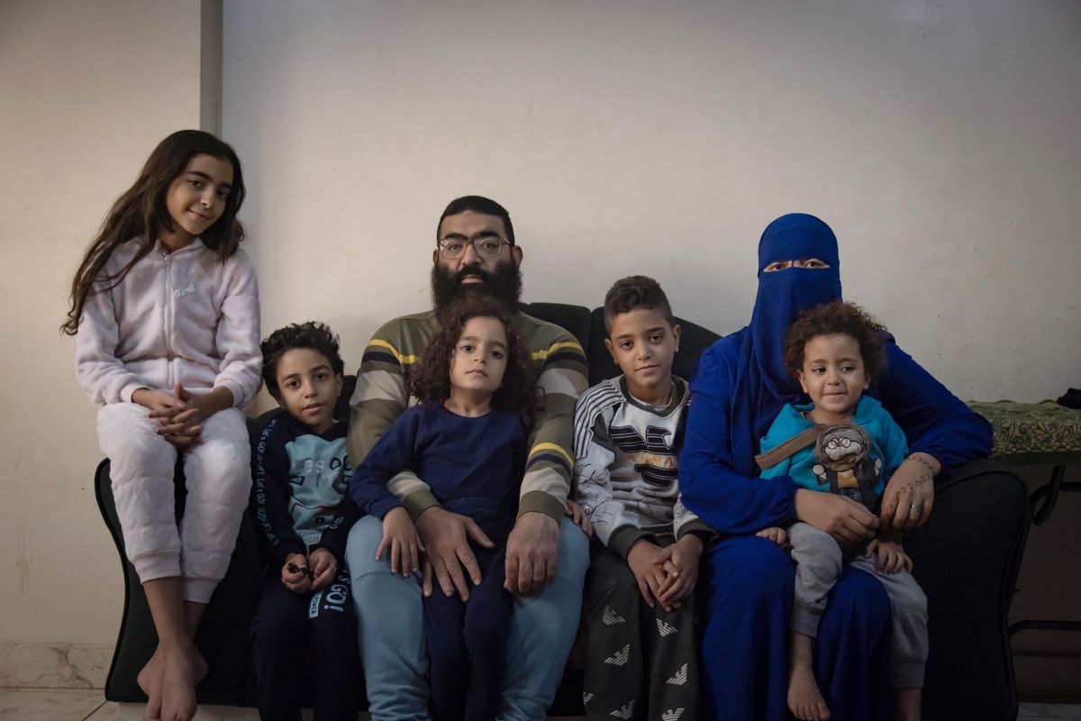Mahmoud Shawky and his wife, Rana Ragab, 32, pose with their five children in their home in Cairo on Nov. 1. MUST CREDIT: Photo for The Washington Post by Sima Diab  (Sima Diab/For The Washington Post)