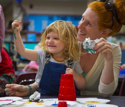 Harley, 2, and Reagan Rufner participate in painting time in the 1-2-3- Grow & Learn program in the library at Roosevelt Elementary on May 20, 2018, in Vancouver, Wash. As student poverty rates soared in “America’s Vancouver,” school officials converted more than half of the district’s campuses into one-stop shops for low-income and homeless families. (Mike Siegel / Seattle Times)