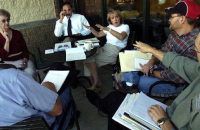 
From left, Jo Shaw, Craig Busch, Cheryl Fleming, Jeff Oas and Craig Culbertson, representing Indian Trail and Five-Mile Prairie neighborhood councils, discuss options in their attempts to stop further development in the area.
 (Holly Pickett / The Spokesman-Review)