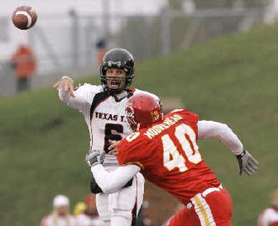 
Texas Tech QB Graham Harrell led a 42-26 win over Iowa State. 
 (Associated Press / The Spokesman-Review)