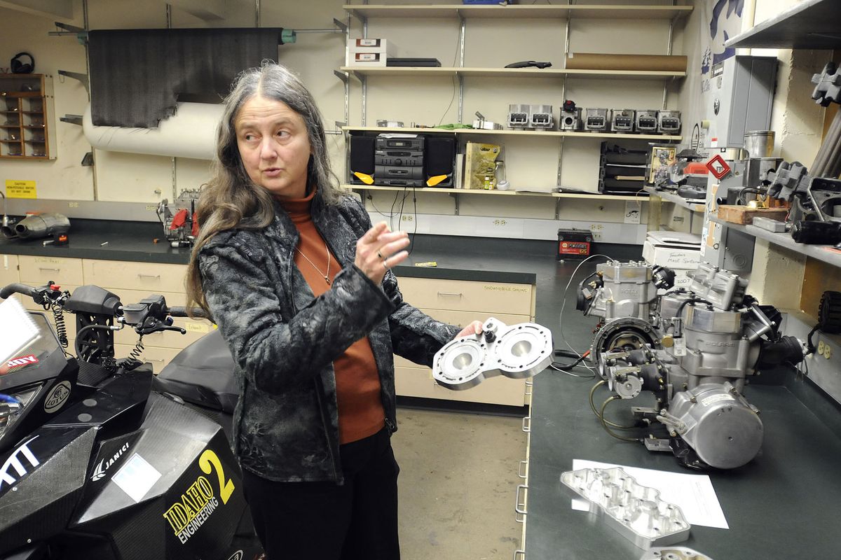 Karen DenBraven, NIATT director at the University of Idaho, explains the research and development the program is doing to make 2-cycle snowmobiles more fuel economical and reduce air and noise pollution. (Associated Press)