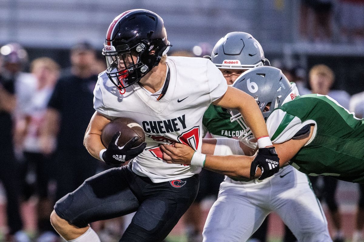 Cheney running back Levi Wills (20) runs the ball as Ridgeline linebacker Ryder Cross (6) make the tackle during the first half of a high school GSL football game at Ridgeline High School in Liberty Lake, Friday, Sept. 12, 2025. (COLIN MULVANY/THE SPOKESMAN-REVI)