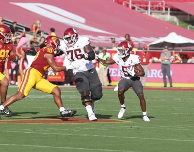 Washington State guard Grant Stephens (76) blocks for receiver Renard Bell during the first half of a Pac-12 game on Saturday against USC at L.A. Memorial Coliseum. Stephens was ejected for targeting in the second half of the game and will miss the first half of WSU’s Pac-12 contest against Oregon State this weekend.  (WSU Athletics)