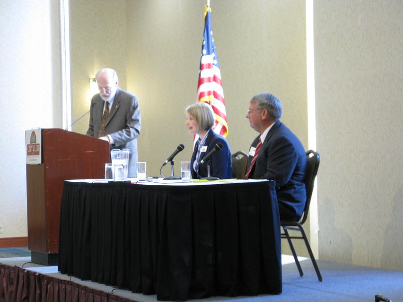 Holli Woodings and Lawerence Denney debate at the City Club of Boise; at left is moderator Jim Weatherby (Betsy Russell)