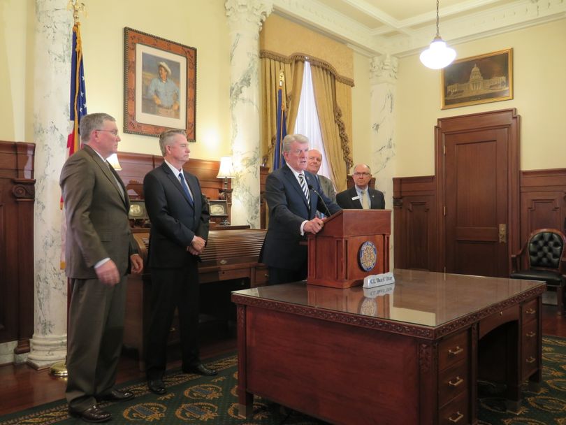 Gov. Butch Otter, joined by GOP legislative leaders, discusses Idaho's just concluded legislative session on Thursday, March 29, 2018, at the Idaho state Capitol. (The Spokesman-Review / Betsy Z. Russell)