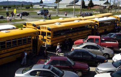 
At the end of school, buses cram into the Freeman Elementary School parking lot next to parked cars. Students from Freeman High School walk across the road to ride the bus home. The $11.7 million construction bond before the voters would allow the Freeman School District to fix some overcrowding issues. 
 (Holly Pickett / The Spokesman-Review)
