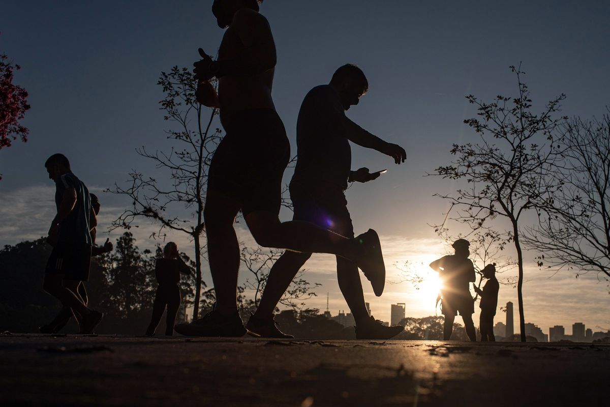 People walk and jog at a park in Sao Paulo on July 13, 2020. Recent research suggests that people who work out have stronger resistance to infectious diseases, but experts say the findings need to be tested further. (VICTOR MORIYAMA)