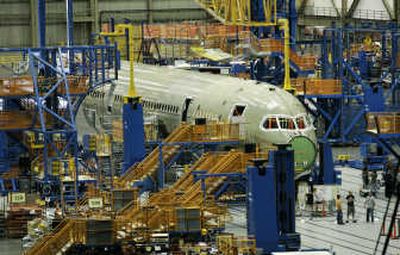 
A Boeing 787 sits on the assembly line at Boeing's assembly plant in Everett. Boeing Co. is delaying initial deliveries of the 787 Dreamliner by six months.Associated Press
 (File Associated Press / The Spokesman-Review)