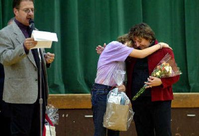 
Teacher Sherry Bell, right, hugs student Brittany Yount during an assembly at Lakeland Junior High Thursday.  
 (Jesse Tinsley / The Spokesman-Review)