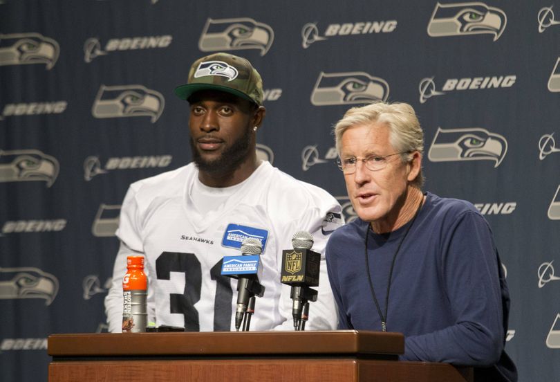 Seahawks head coach Pete Carroll, right, and star strong safety Kam Chancellor painted a positive picture during Wednesday’s press conference. (Associated Press)
