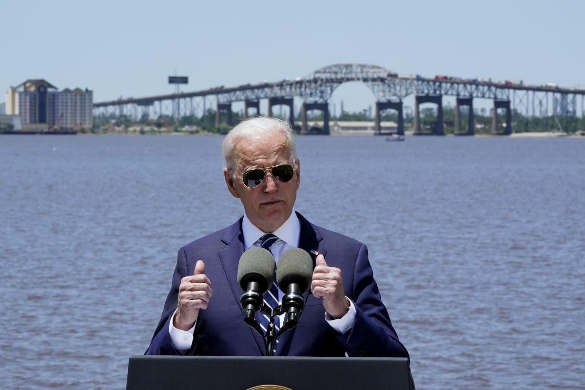 President Joe Biden, promoting his infrastructure plan, speaks with the Interstate 10 Calcasieu River Bridge behind him Thursday in Lake Charles, La.  (Associated Press)