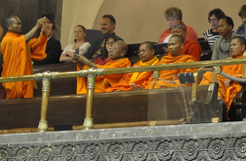 OLYMPIA -- Five Buddhist monks watch the debate on the 2015-17 operating budget from the Senate Gallery on Monday evening, June 29, 2015. (Jim Camden/Spokesman-Review)